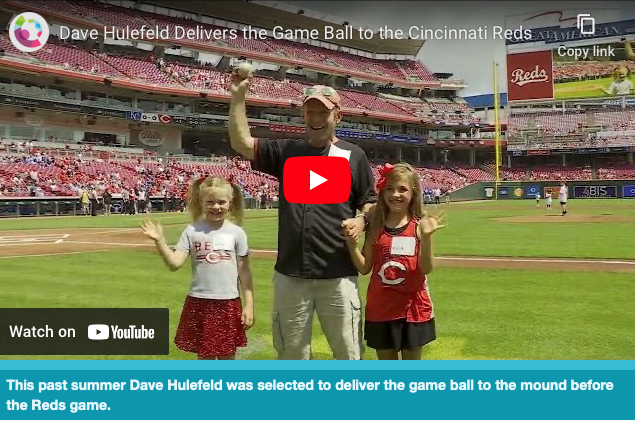 Radiology’s Dave Hulefeld Delivers the Red’s Game Ball to the Mound 